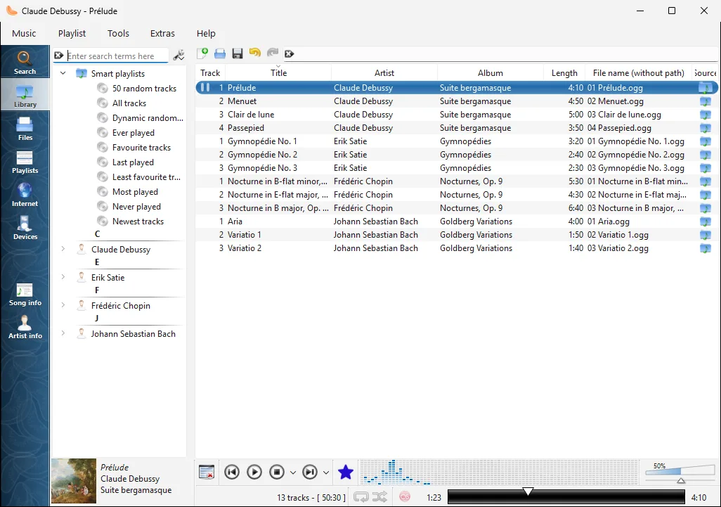 Clementine on Windows showing an artist library, smart playlists, track table and playback controls in the light theme