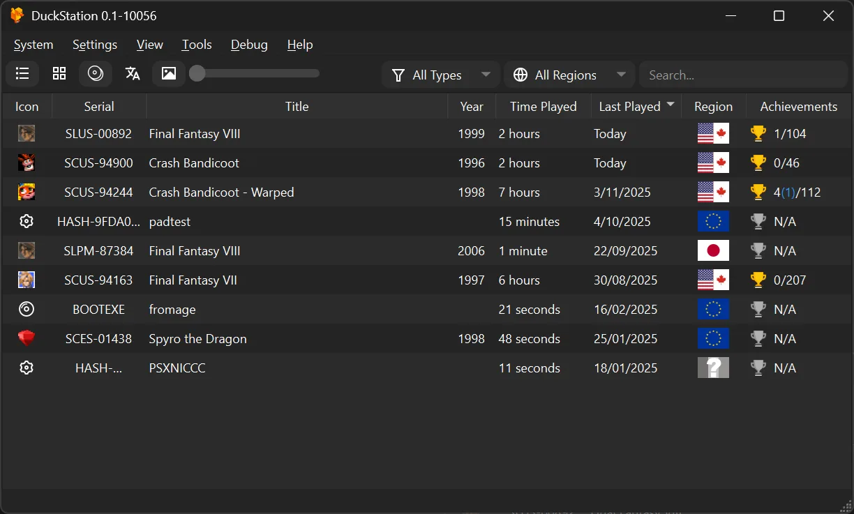 DuckStation Windows main window showing a game library with title, region, play-time and achievement columns