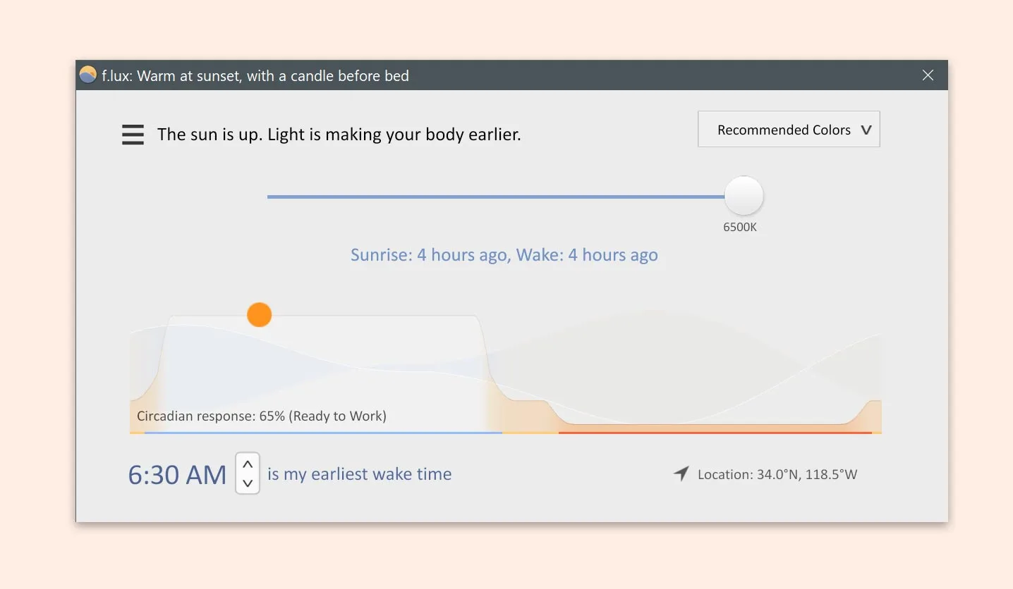 f.lux for Windows showing a 6500K color-temperature slider, daily lighting graph, wake-time control and location