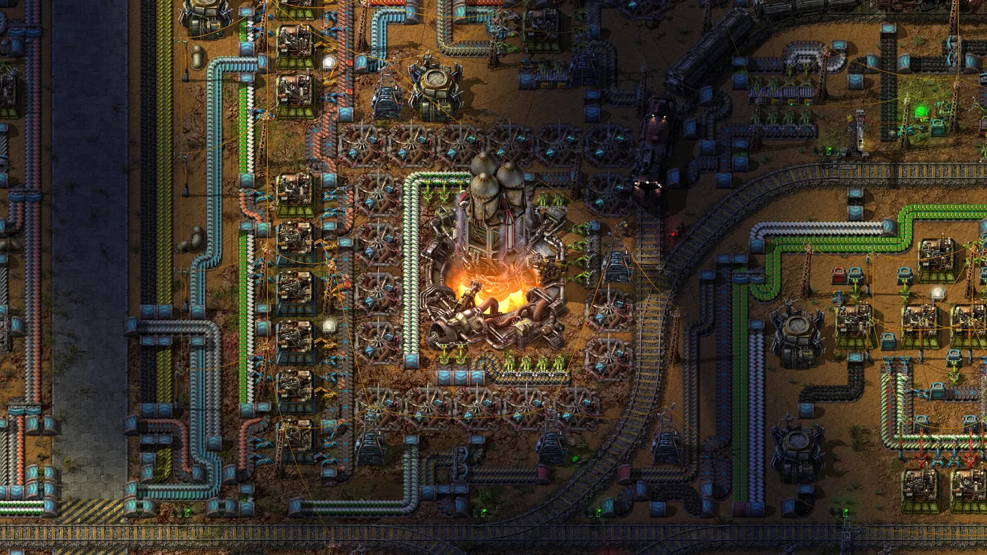 Factorio gameplay showing a rocket launching amid conveyor belts, production machines and railway tracks