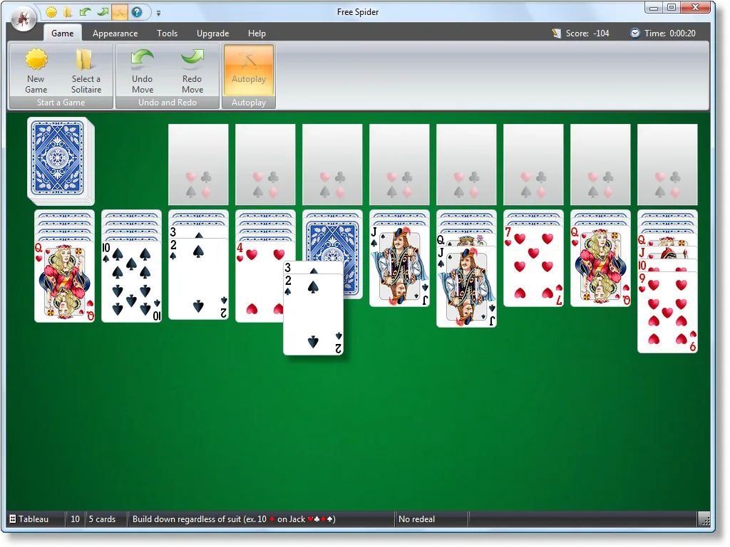 Free Spider Solitaire desktop window with a green table, ten card columns and the game ribbon toolbar.