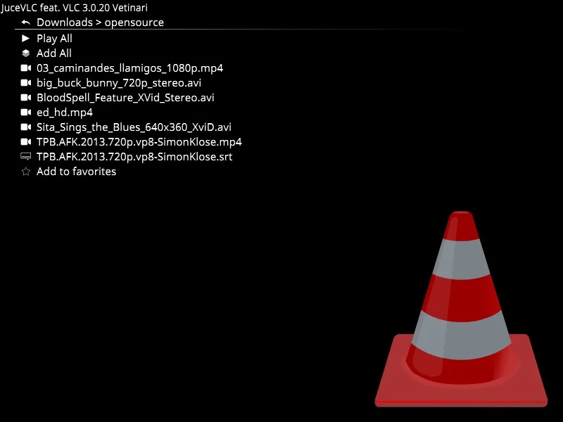 JuceVLC filesystem browser showing Play All, video files and Add to favorites in its fullscreen interface