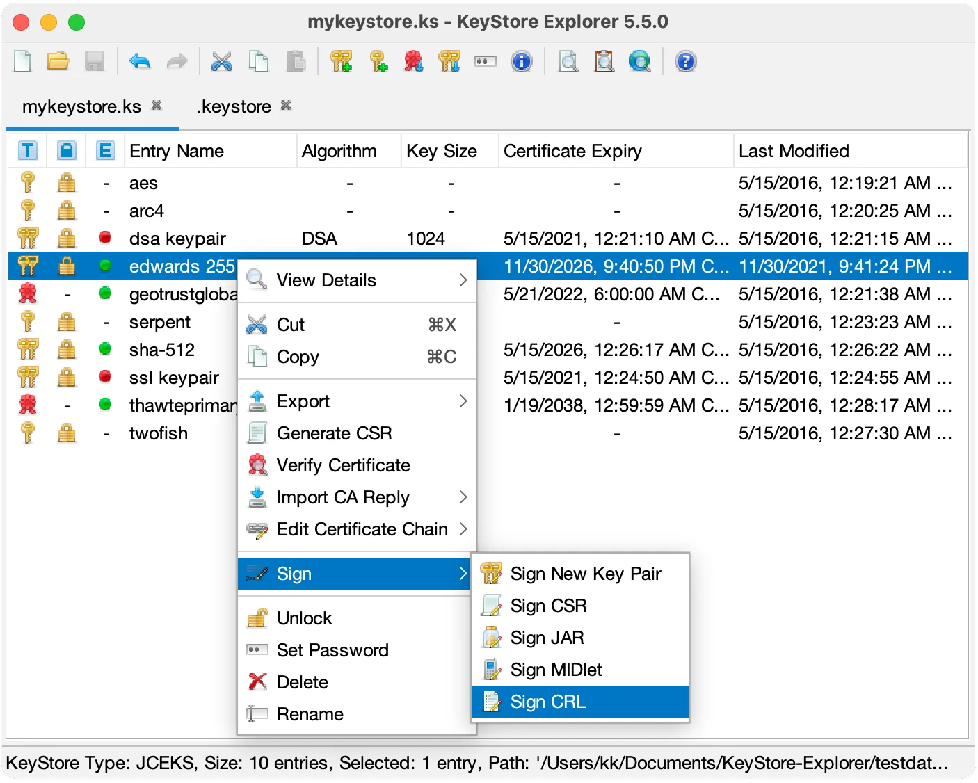 KeyStore Explorer 5.5.0 on macOS showing keystore entries and a key-pair signing submenu; older publisher illustration.