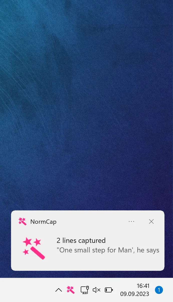 NormCap Windows notification reporting two lines captured, above the Windows taskbar