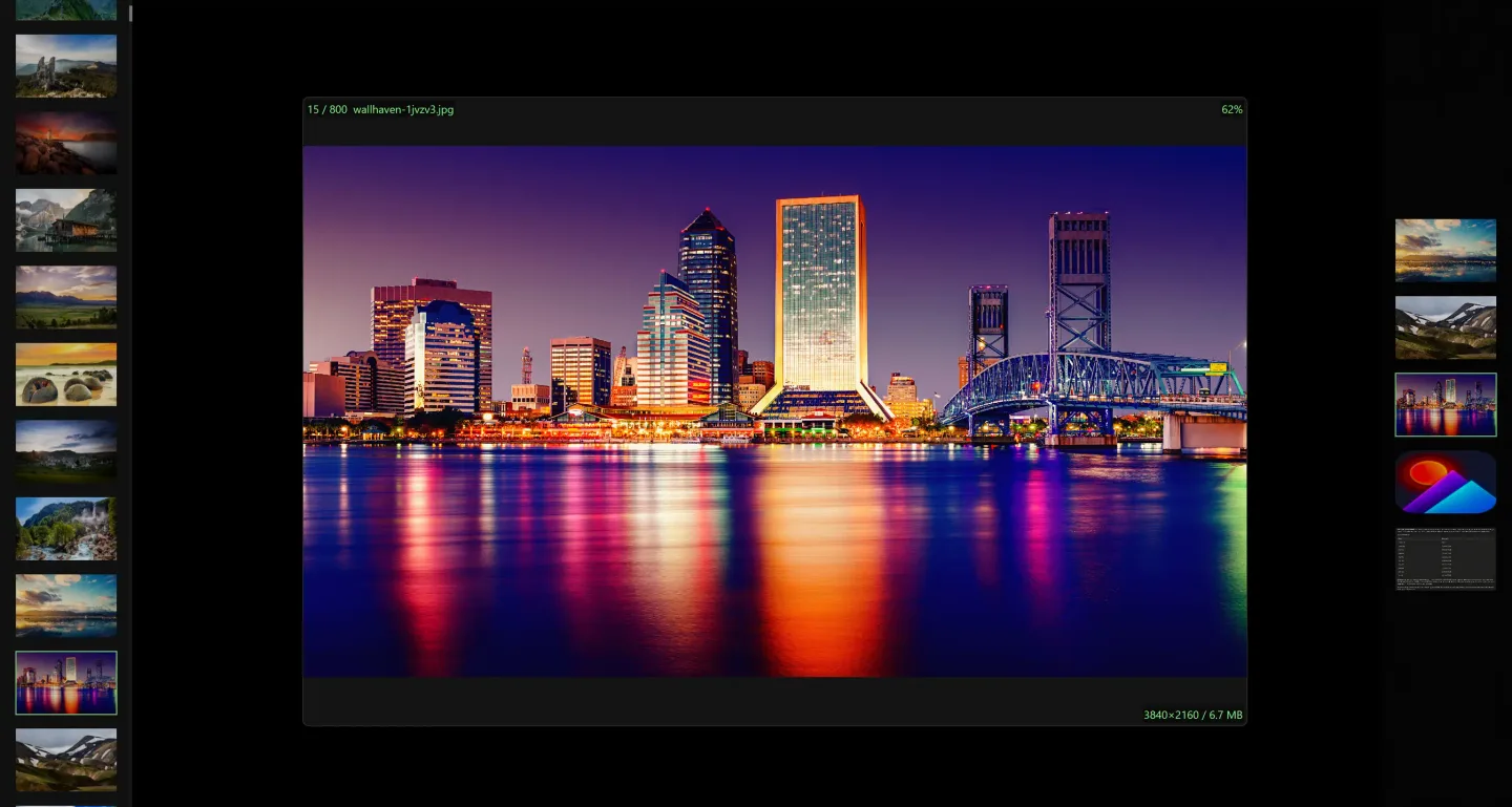 QuickImageViewer showing a nighttime city photo with thumbnail strips on both sides and image information overlays.