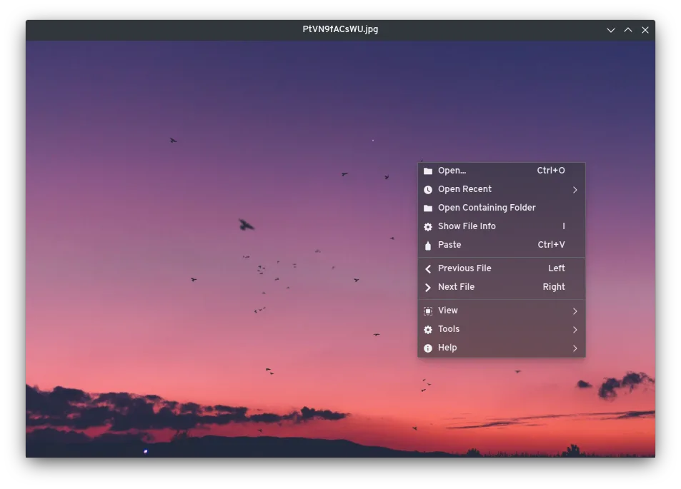 Publisher cross-platform qView screenshot showing a sunset photograph and the Open, recent files, navigation, View and Tools context menu; not a macOS capture.