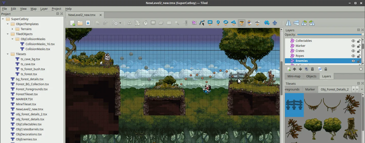 Publisher screenshot of Tiled editing a SuperCatboy forest level, with a project tree, tile grid, object layers and tileset palette; not a Mac capture.