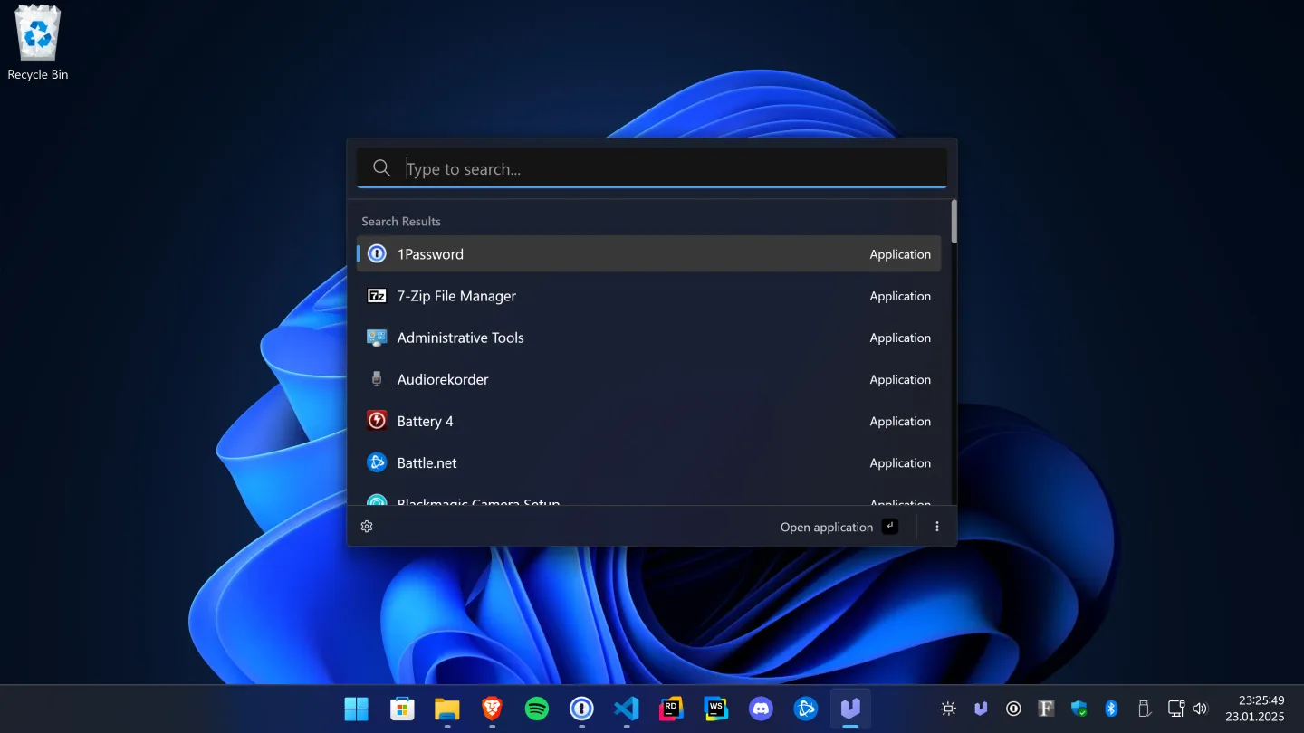 Ueli's dark Windows launcher with an application search field and a list of installed apps on a Windows desktop.