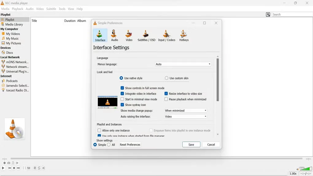 VLC for Windows showing Simple Preferences Interface Settings over the playlist window