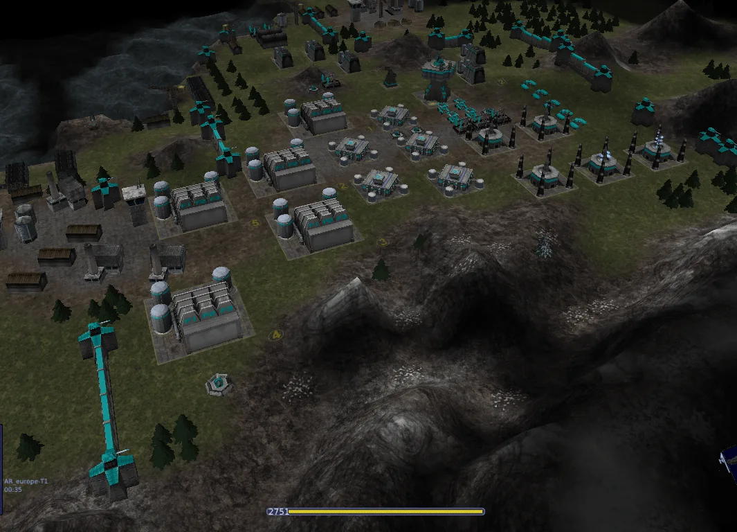 Warzone 2100 base with teal defenses and production buildings on mountainous terrain